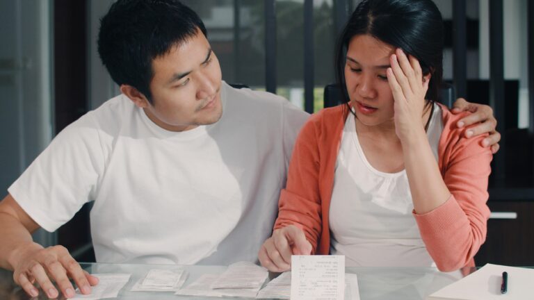 A distressed couple struggling with loan rejection